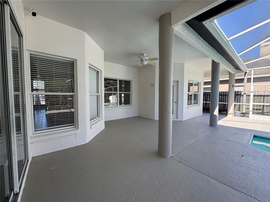 28724 Hanging Moss Loop Wesley Chapel, FL 33543 - Photo 23 of 30 a view of a house with a backyard