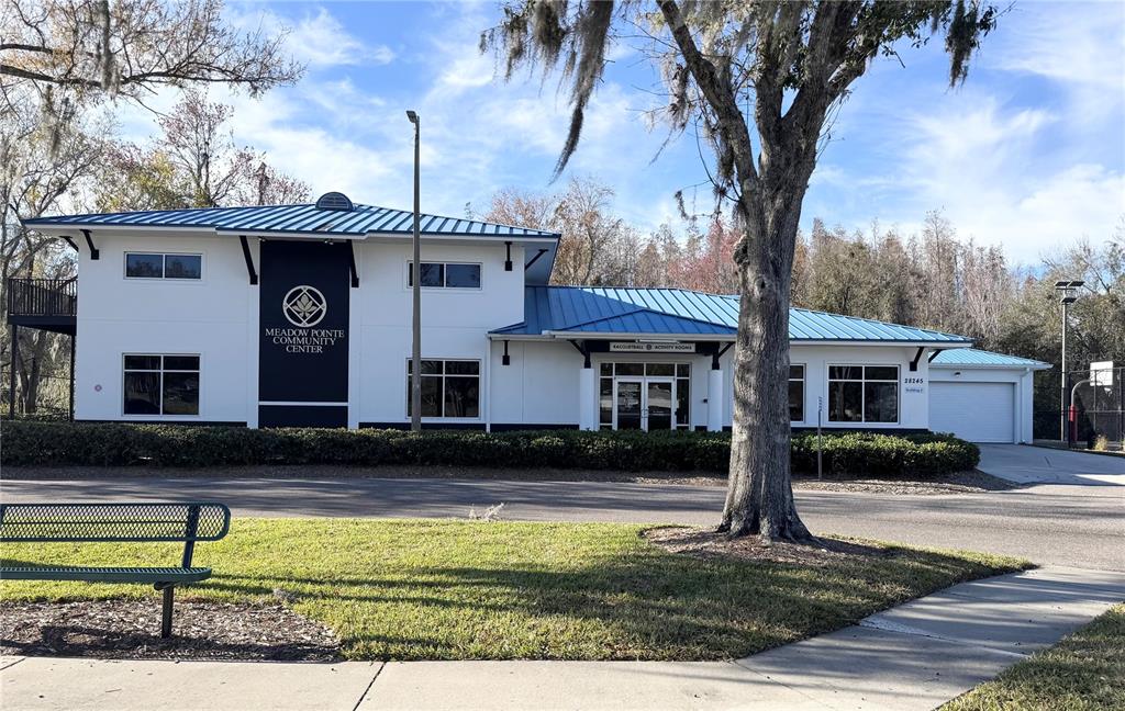 28724 Hanging Moss Loop Wesley Chapel, FL 33543 - Photo 30 of 30 a front view of a house with garden