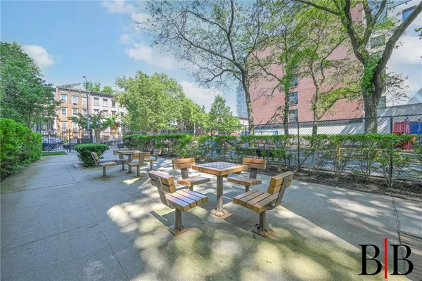 a view of a backyard with sitting area