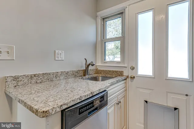a kitchen with stainless steel appliances granite countertop a stove and a microwave