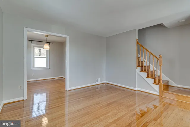 a view of an entryway with wooden floor