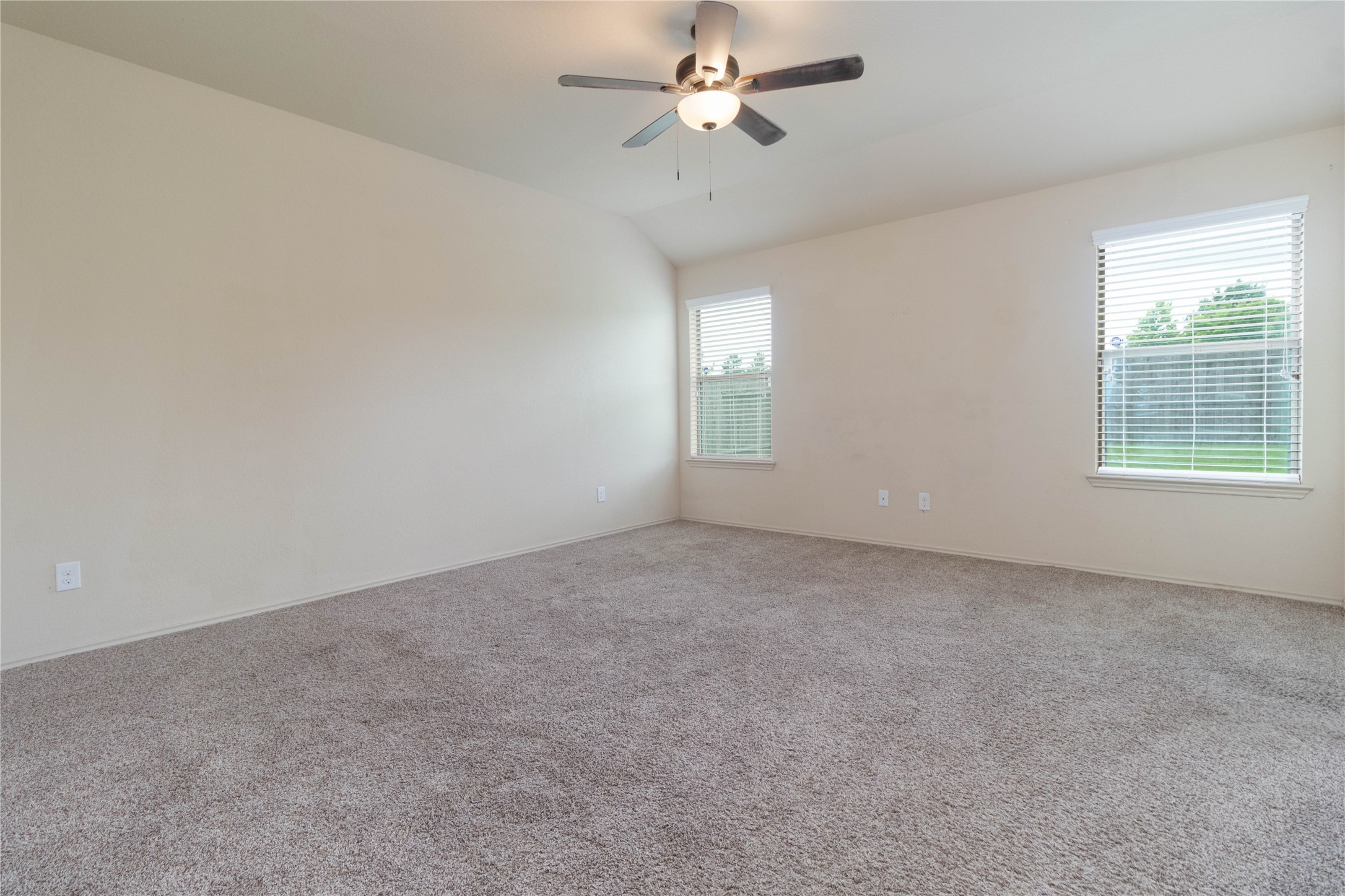 24423 Raindrop Poppy Drive Spring, TX 77373 - Photo 12 of 29 an empty room with a window and ceiling fan