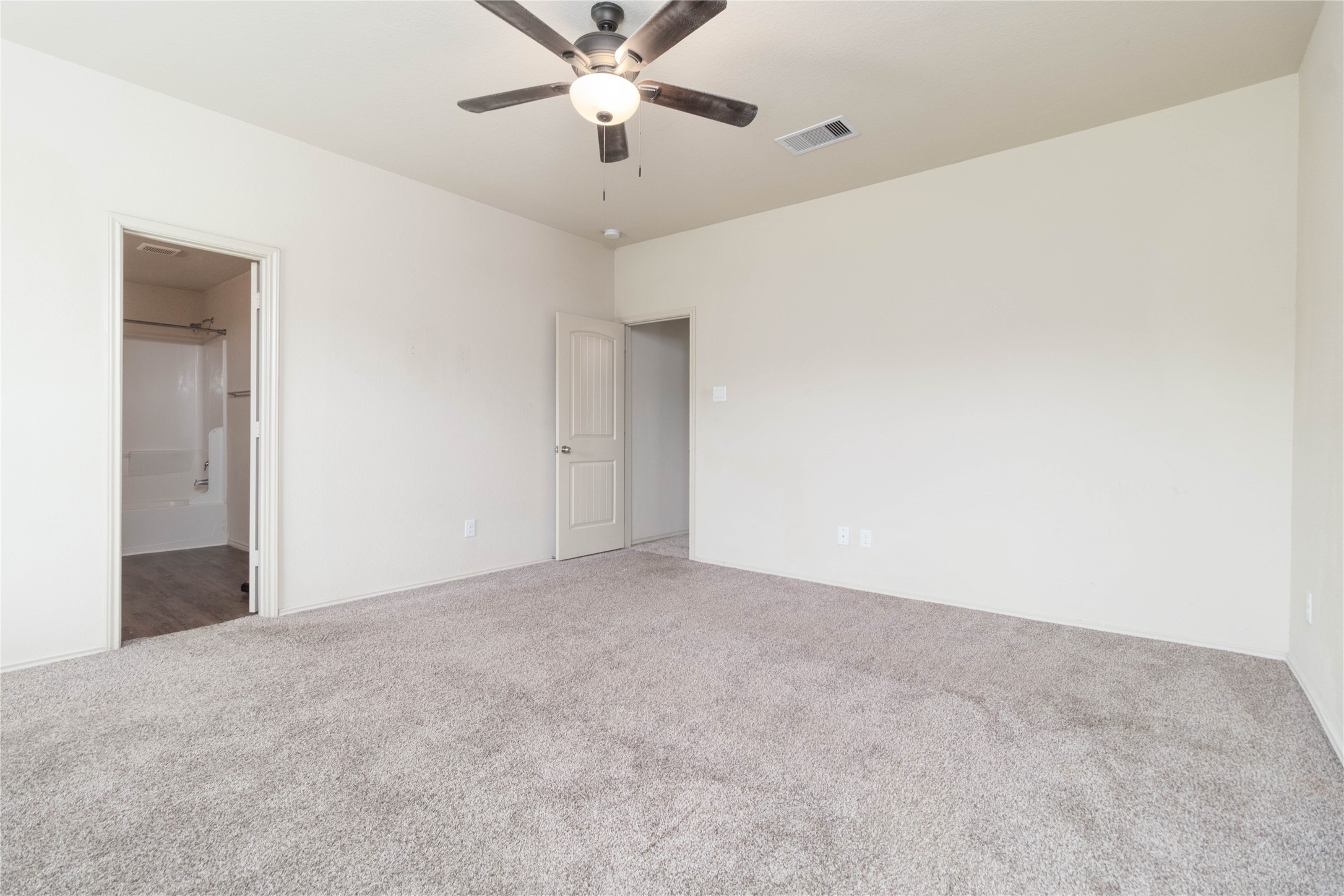 24423 Raindrop Poppy Drive Spring, TX 77373 - Photo 13 of 29 a view of an empty room with a fan