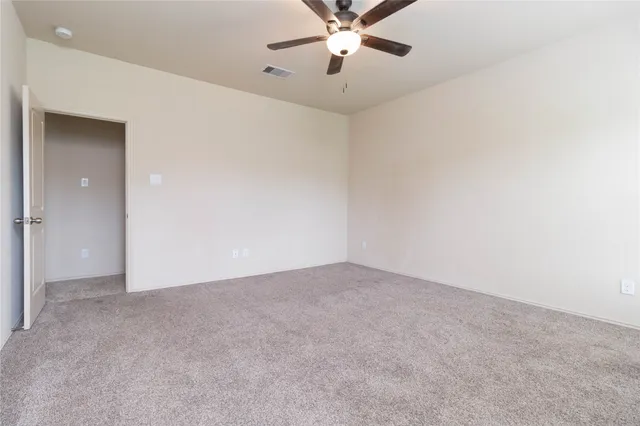 an empty room with fan