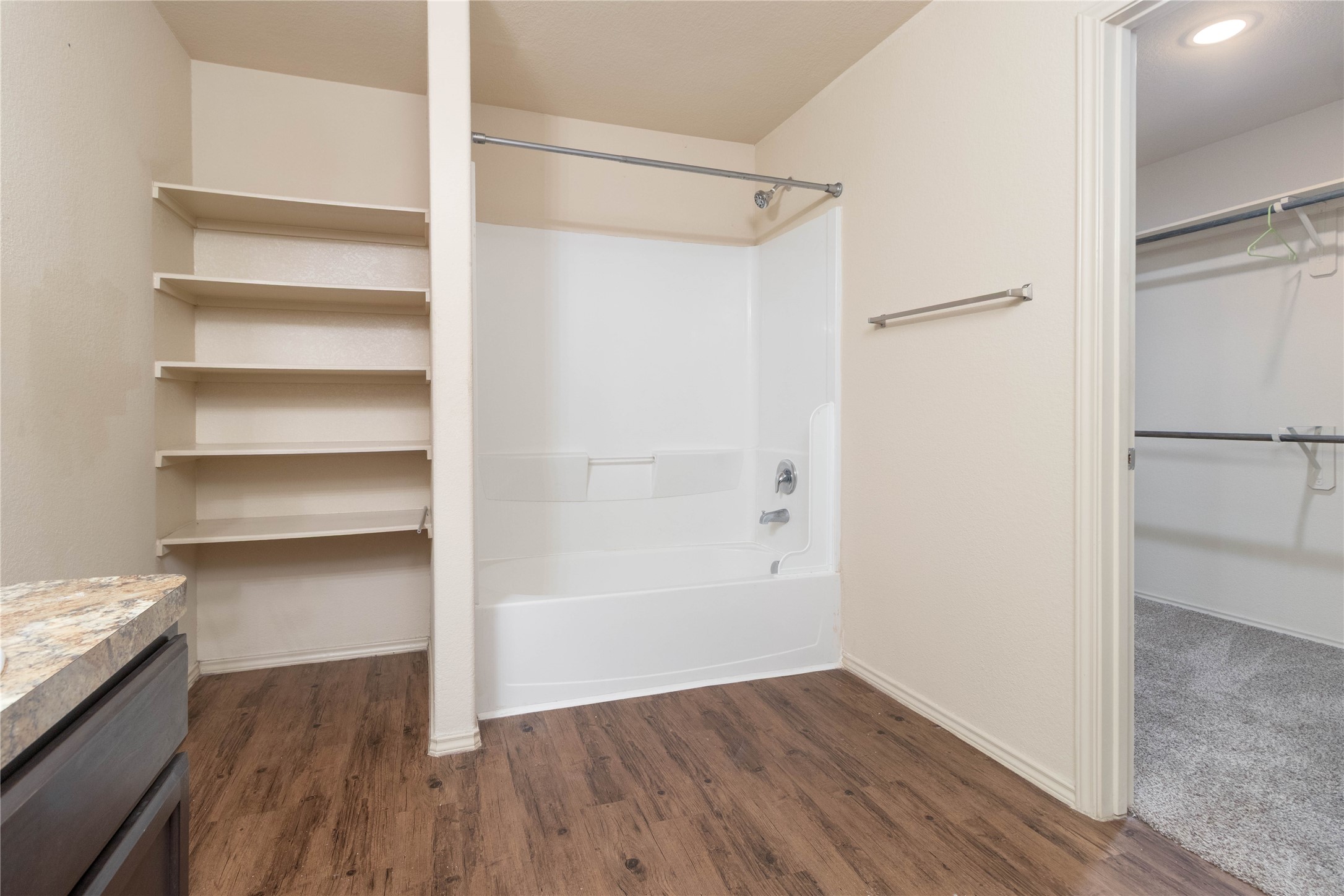 24423 Raindrop Poppy Drive Spring, TX 77373 - Photo 16 of 29 a view of walk in closet with empty racks