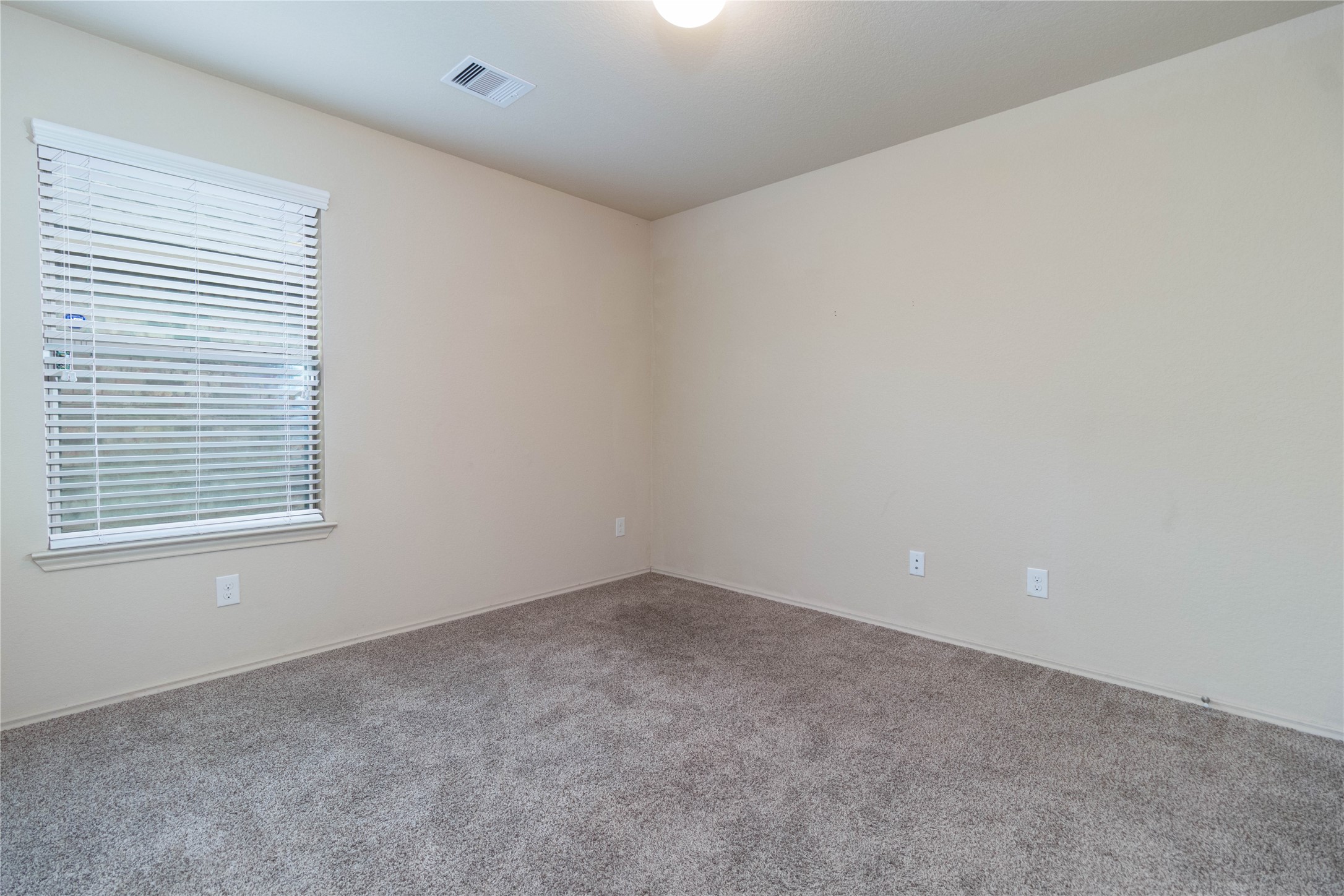24423 Raindrop Poppy Drive Spring, TX 77373 - Photo 19 of 29 an empty room with a window