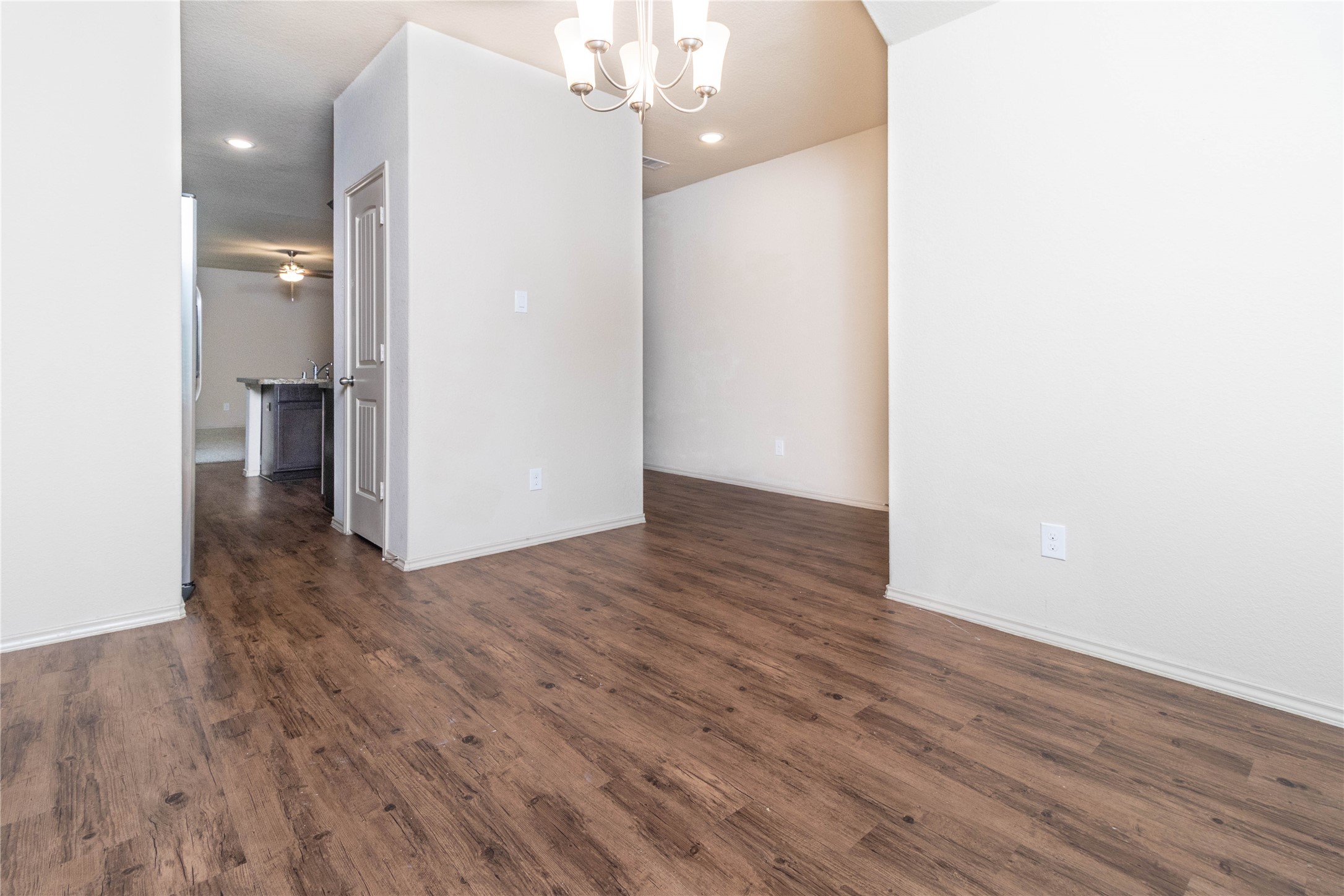 24423 Raindrop Poppy Drive Spring, TX 77373 - Photo 9 of 29 a view of a livingroom with wooden floor