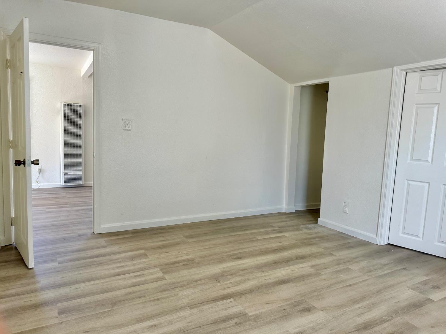 809 Washington Avenue Madera, CA 93638 - Photo 7 of 20 a view of an empty room with wooden floor