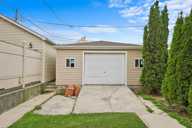 a view of backyard of house with green space
