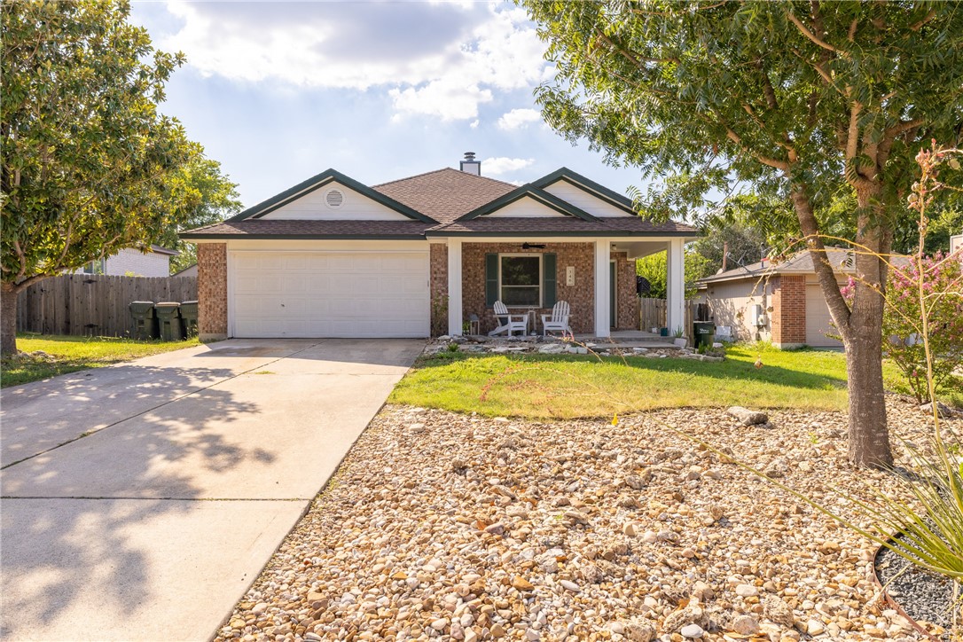 a view of a house with swimming pool and a yard