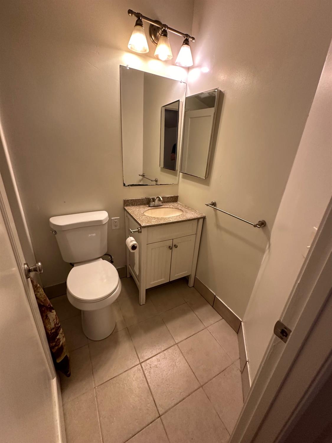 11375 Alta Mesa Road Wilton, CA 95693 - Photo 21 of 27 a bathroom with a toilet sink and mirror