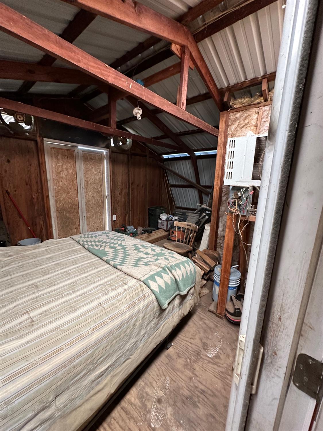 11375 Alta Mesa Road Wilton, CA 95693 - Photo 25 of 27 a bedroom with a bed with the view of bathroom