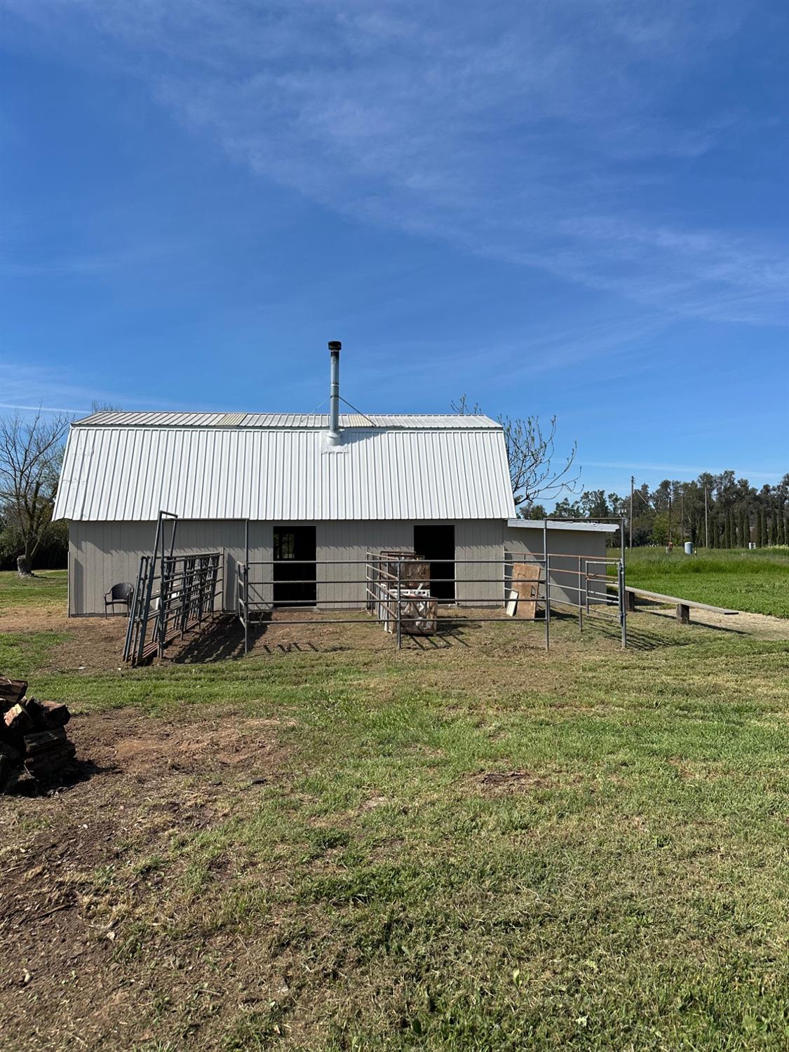 11375 Alta Mesa Road Wilton, CA 95693 - Photo 3 of 27 a view of a house with a backyard and a tree