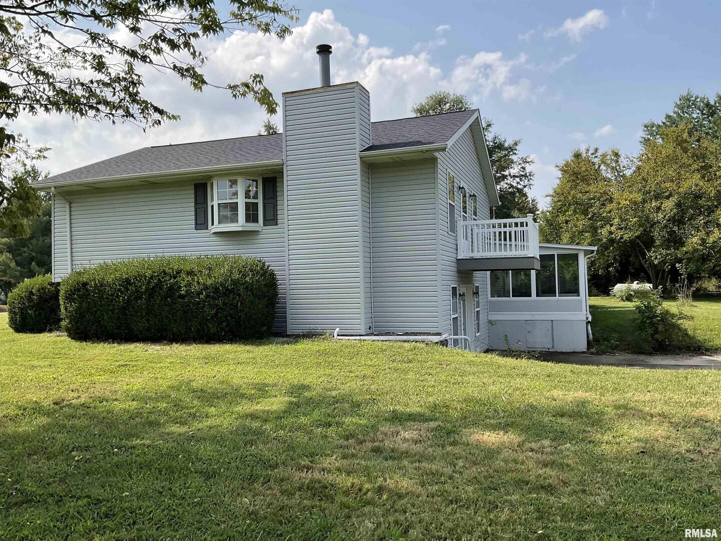 12 Hickory Road Nashville, IL 62263 - Photo 5 of 57 a view of an house with backyard space and a kitchen