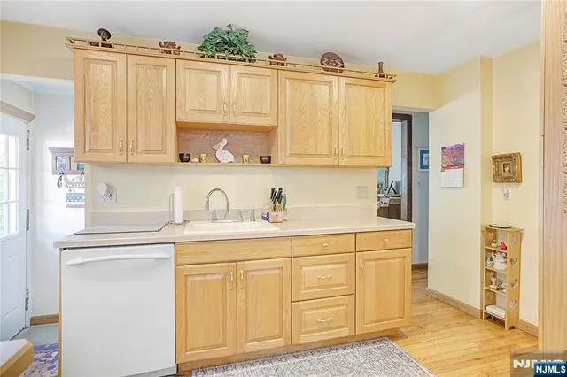 a kitchen with stainless steel appliances granite countertop a sink and cabinets