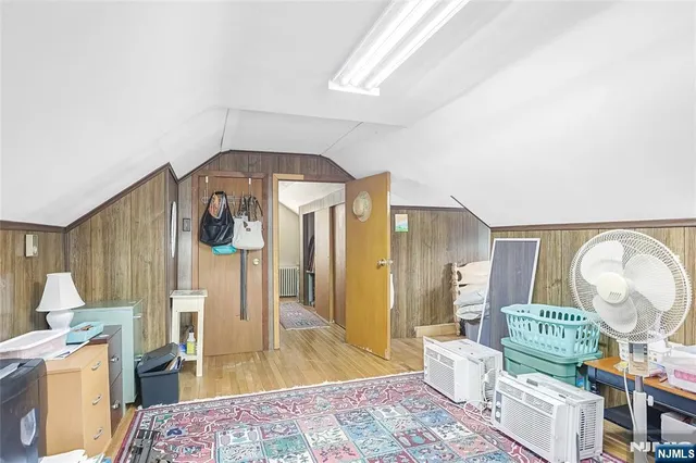 a living room with furniture a rug and a fireplace