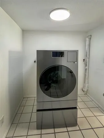 a utility room with washing machine