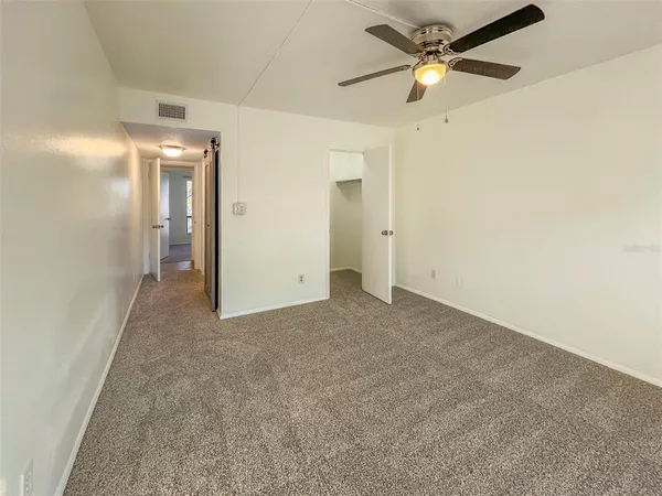 a view of a big room with carpet