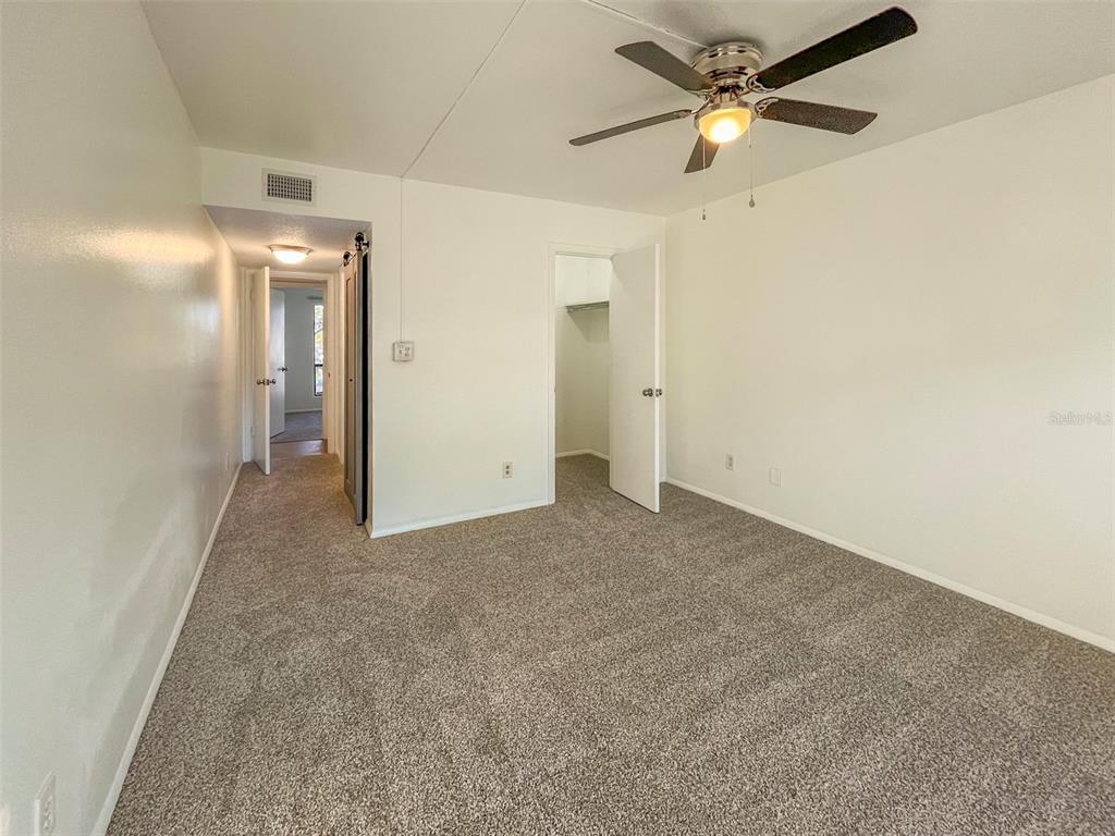 4001 South Beneva Road, Unit 416 Sarasota, FL 34233 - Photo 7 of 19 a view of a big room with carpet