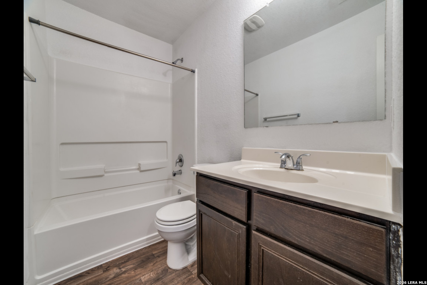 2426 Rainbow Basin Converse, TX 78109 - Photo 11 of 12 a bathroom with a granite countertop sink toilet and shower
