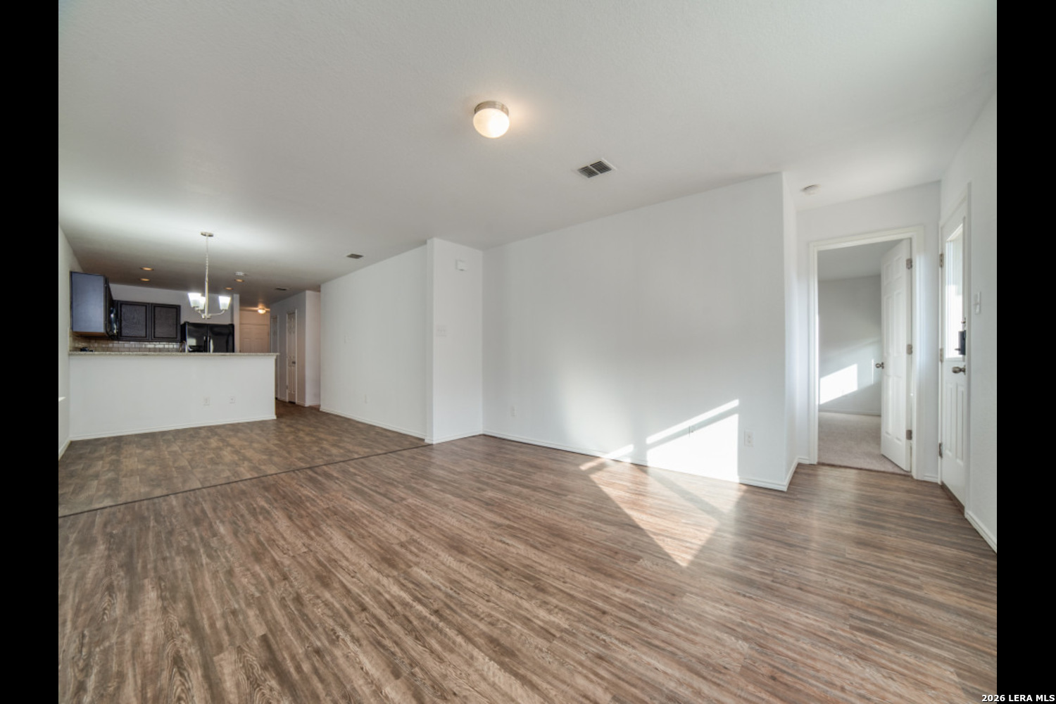 2426 Rainbow Basin Converse, TX 78109 - Photo 5 of 12 a view of empty room with wooden floor