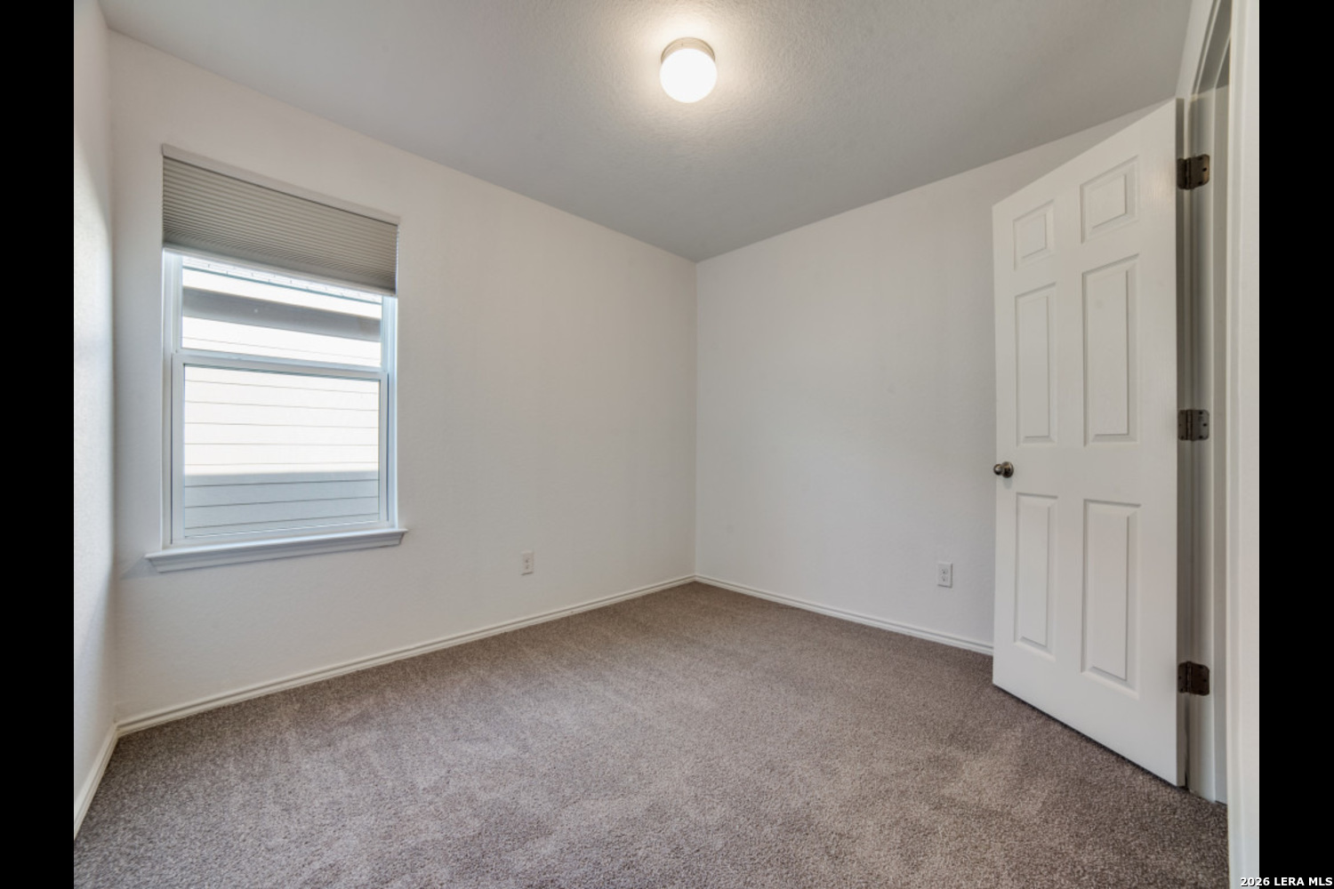 2426 Rainbow Basin Converse, TX 78109 - Photo 7 of 12 an empty room with a window
