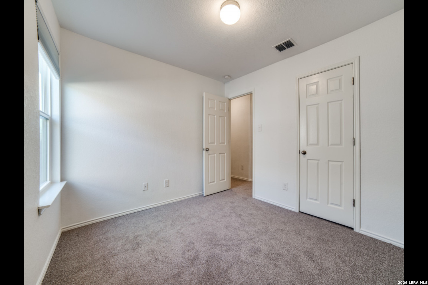 2426 Rainbow Basin Converse, TX 78109 - Photo 9 of 12 an empty room with windows
