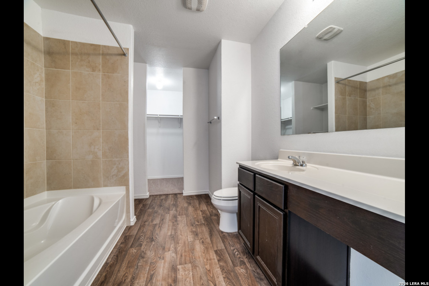 2426 Rainbow Basin Converse, TX 78109 - Photo 10 of 12 a bathroom with a tub sink and mirror