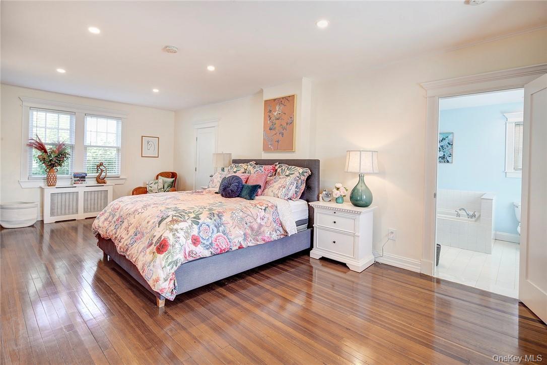 8 Horton Street Rye, NY 10580 - Photo 11 of 24 Spacious Primary Bedroom with hardwood flooring, radiator,4 closets, adjacent 2nd Lndry rm/closet, and recessed lighting