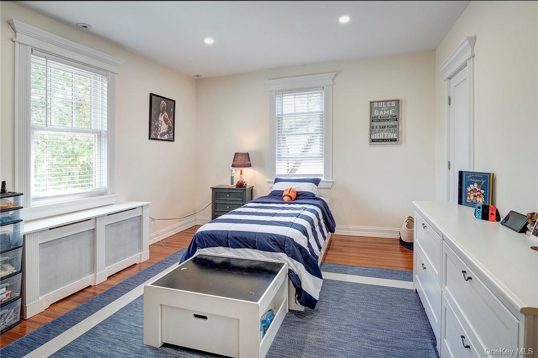 8 Horton Street Rye, NY 10580 - Photo 14 of 24 Bedroom featuring hardwood floors and recessed lighting