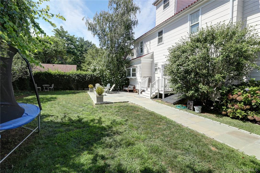 8 Horton Street Rye, NY 10580 - Photo 21 of 24 View of back yard featuring a patio, off kitchen