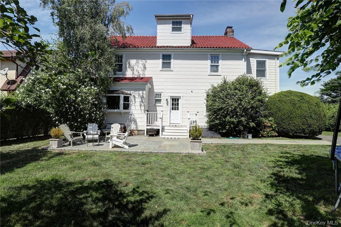 8 Horton Street Rye, NY 10580 - Photo 22 of 24 Rear view of house with patio and tiled roof.