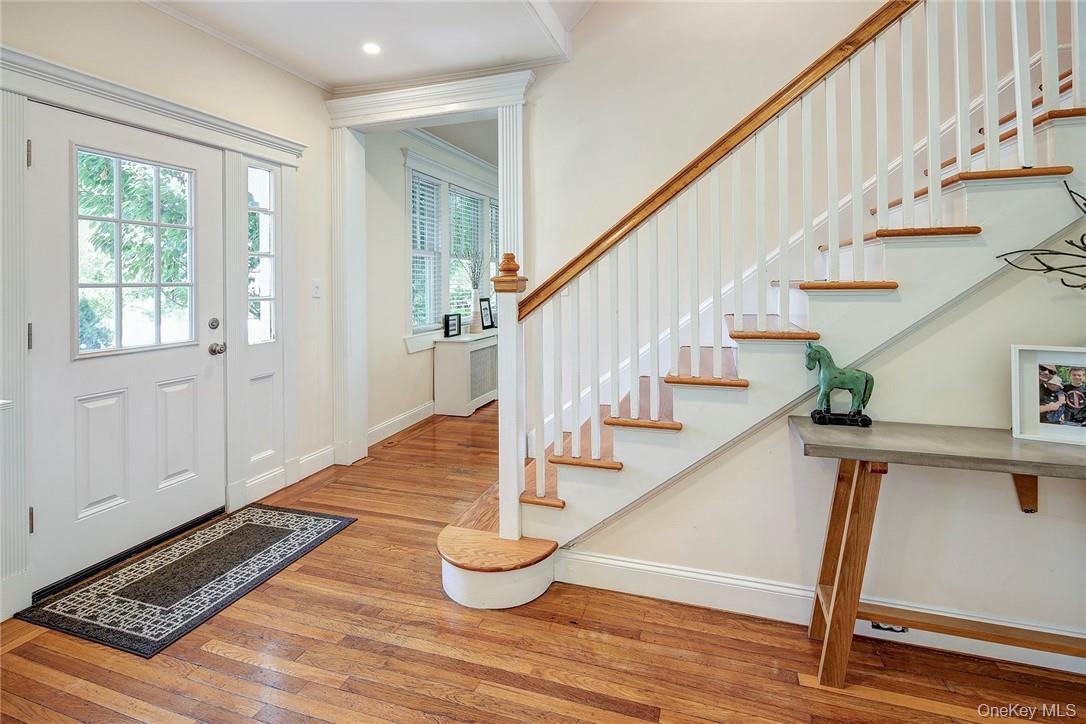 8 Horton Street Rye, NY 10580 - Photo 3 of 24 Center Hall featuring light hardwood floors and ornamental molding