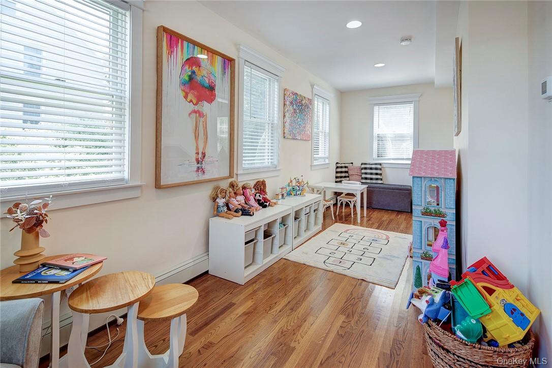 8 Horton Street Rye, NY 10580 - Photo 8 of 24 Rec room/Sun Rm with light hardwood floors