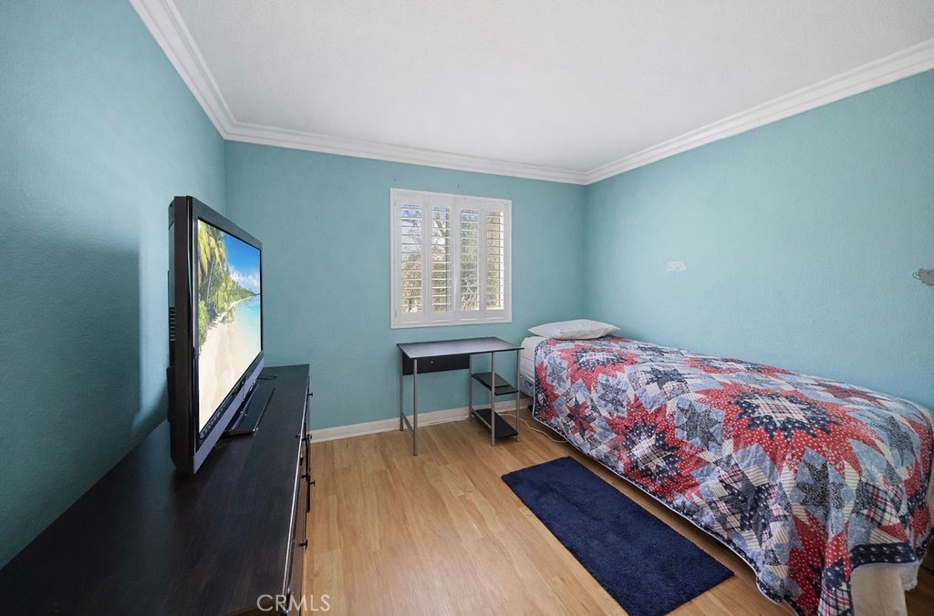 7606 Isla Street Hemet, CA 92545 - Photo 18 of 41 a bedroom with a bed and a window