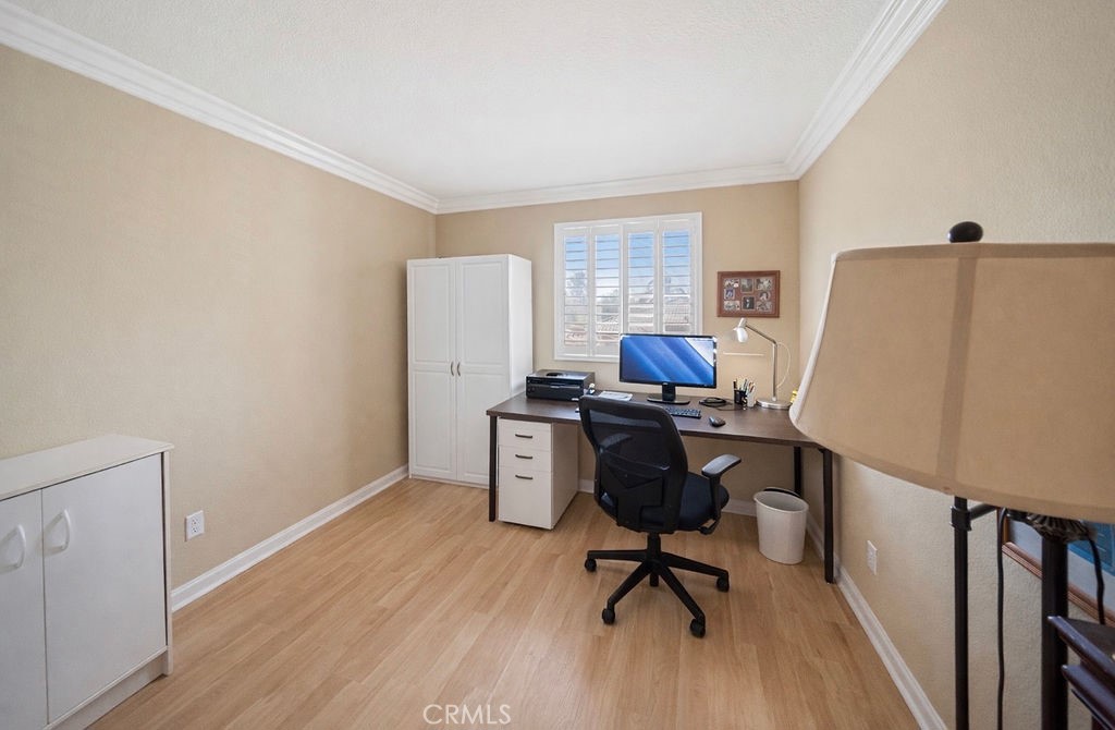 7606 Isla Street Hemet, CA 92545 - Photo 19 of 41 a view of a workspace with furniture and a window