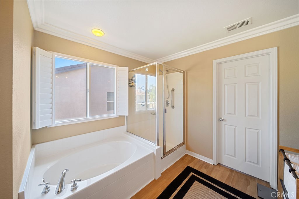 7606 Isla Street Hemet, CA 92545 - Photo 20 of 41 a bathroom with a bathtub and a shower