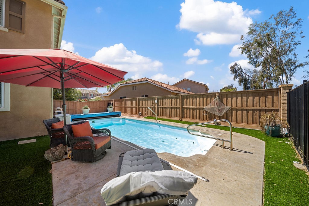 7606 Isla Street Hemet, CA 92545 - Photo 30 of 41 a view of a house with backyard and sitting area