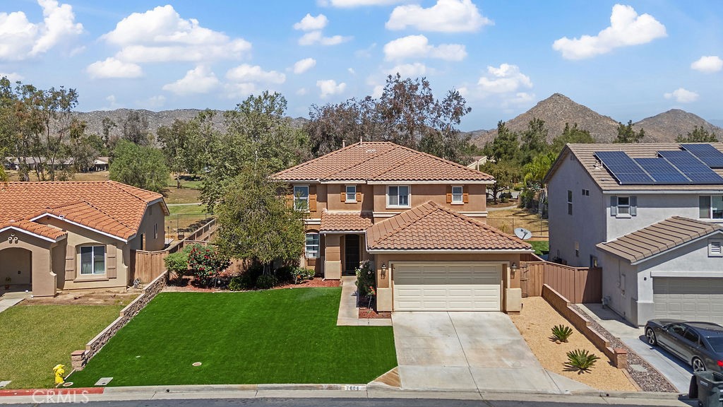 7606 Isla Street Hemet, CA 92545 - Photo 31 of 41 a front view of a house with a yard