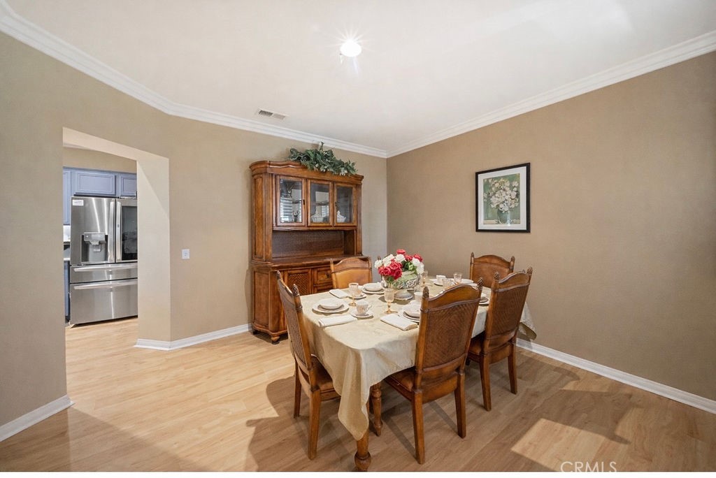 7606 Isla Street Hemet, CA 92545 - Photo 6 of 41 a dining room with furniture and window