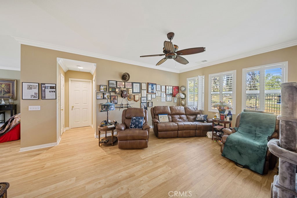 7606 Isla Street Hemet, CA 92545 - Photo 7 of 41 a living room with furniture and a large window