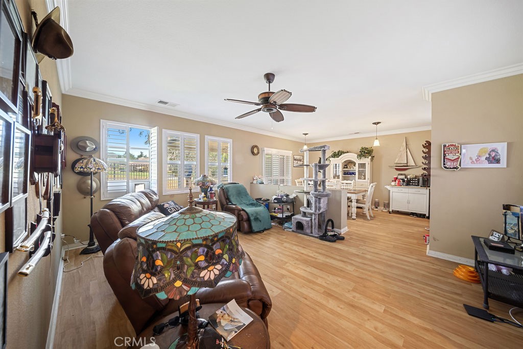 7606 Isla Street Hemet, CA 92545 - Photo 8 of 41 a living room with furniture and a flat screen tv
