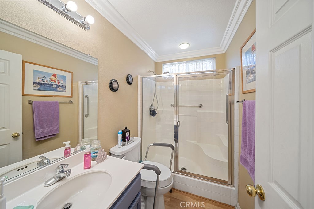 7606 Isla Street Hemet, CA 92545 - Photo 9 of 41 a bathroom with a sink mirror and a shower