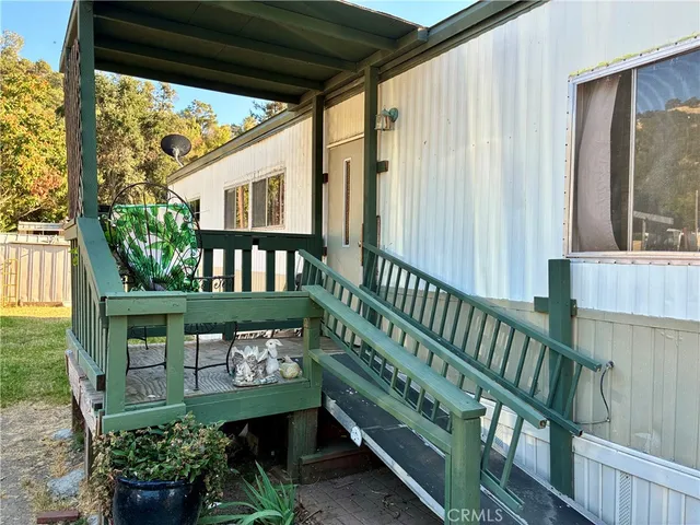 a view of a chair and table in the balcony