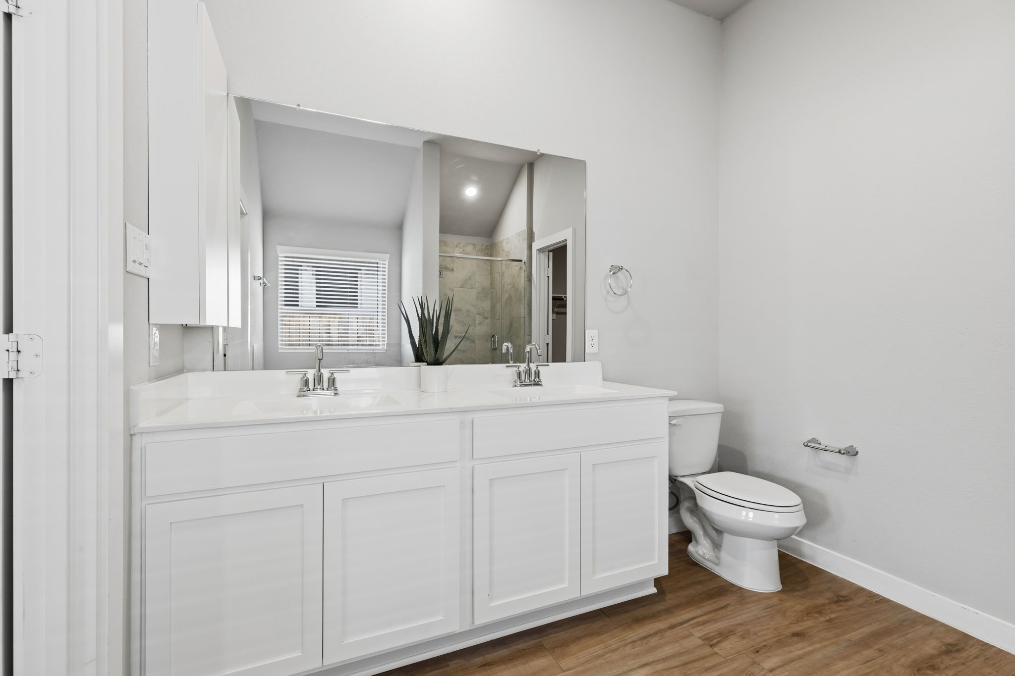 14914 Big Bend Ranch Drive Cypress, TX 77433 - Photo 20 of 49 a bathroom with a double vanity sink toilet and a mirror