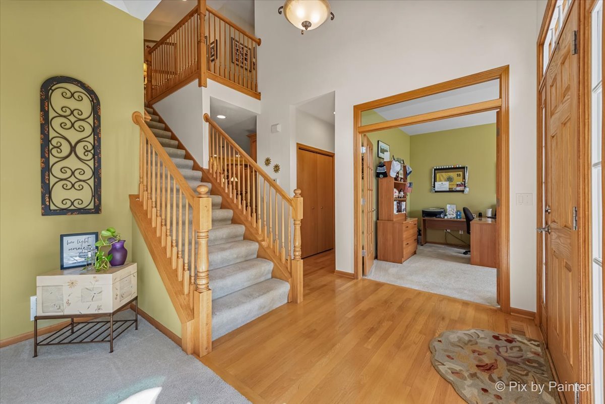 3720 Cypress Drive Spring Grove, IL 60071 - Photo 21 of 55 a view of a livingroom with furniture and stairs