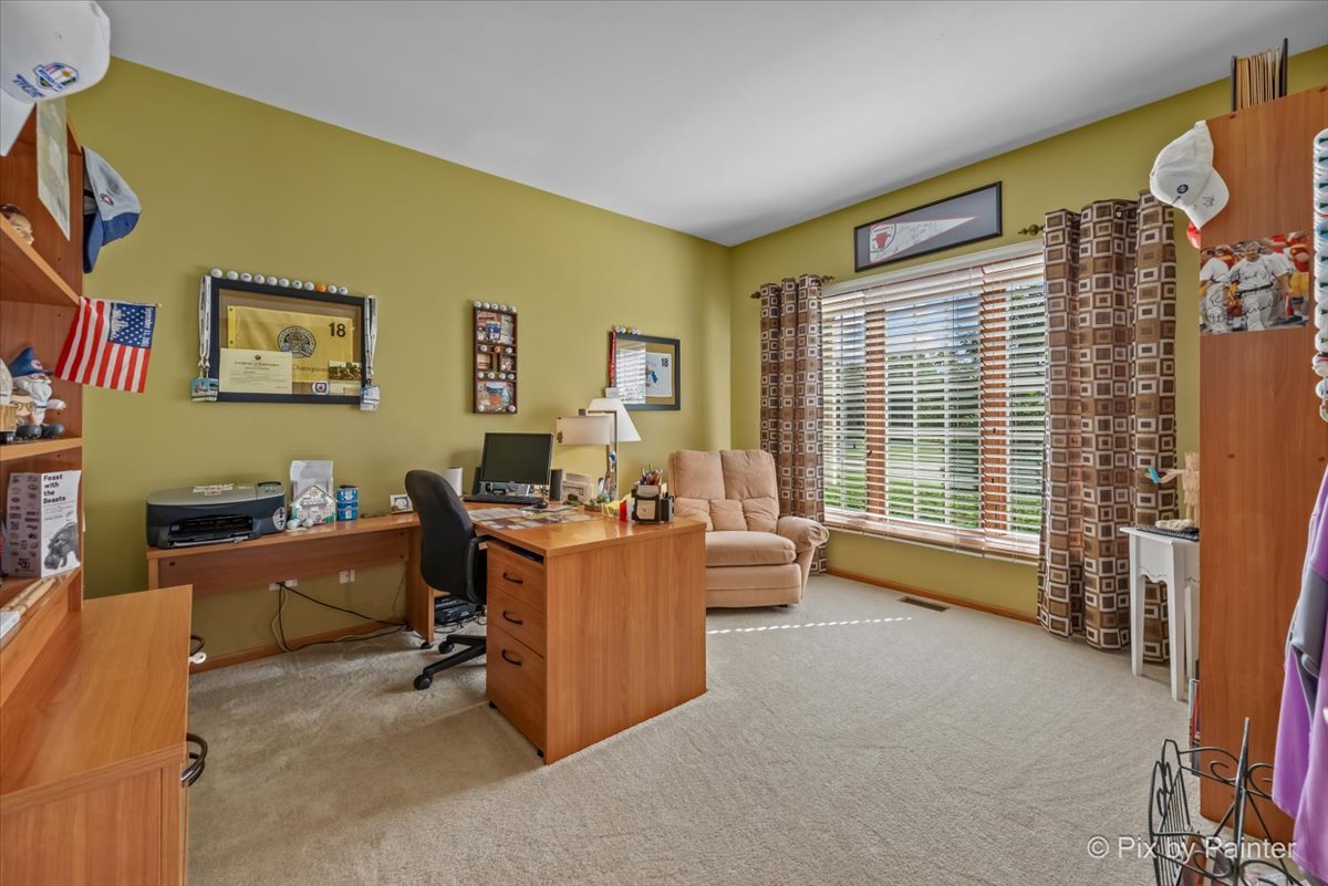 3720 Cypress Drive Spring Grove, IL 60071 - Photo 22 of 55 a view of a livingroom with workspace and a window