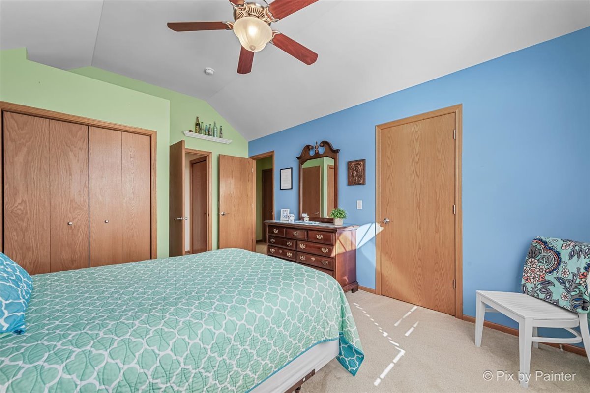 3720 Cypress Drive Spring Grove, IL 60071 - Photo 29 of 55 a bedroom with a bed dresser and a window