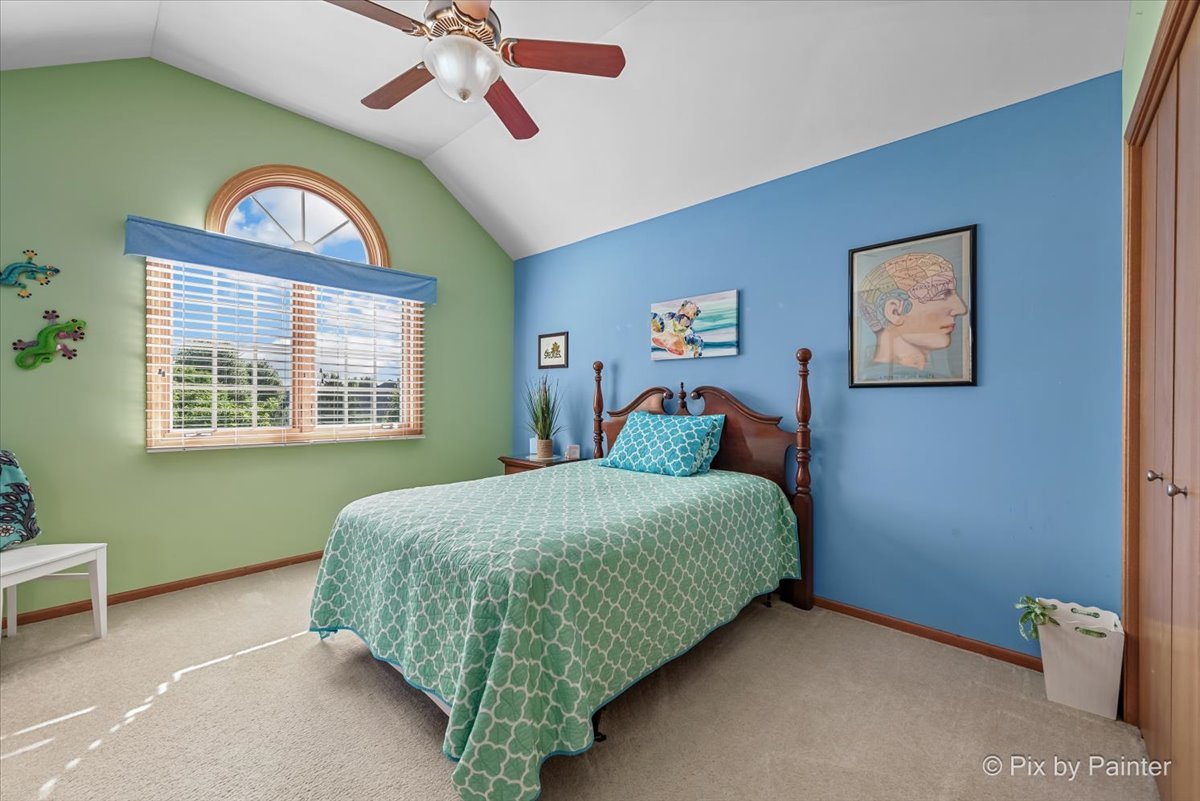 3720 Cypress Drive Spring Grove, IL 60071 - Photo 30 of 55 a bedroom with a bed and a window