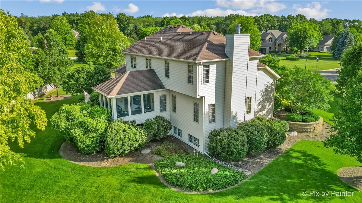 3720 Cypress Drive Spring Grove, IL 60071 - Photo 38 of 55 a aerial view of a house with a yard table and chairs